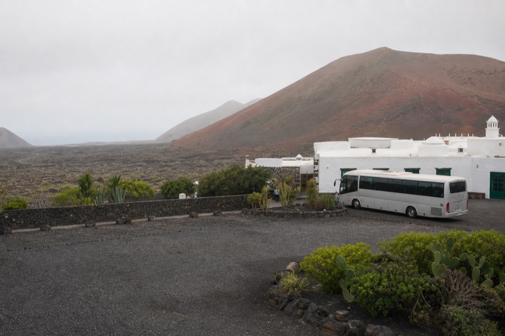 Timanfaya visitor centre with car park and volcano in background