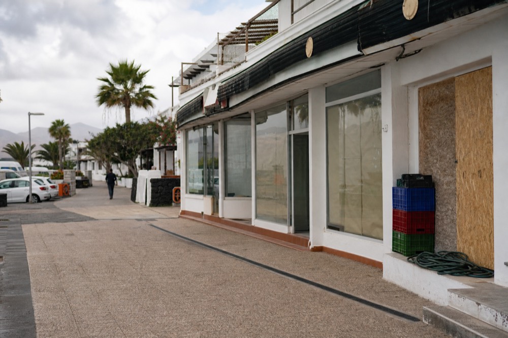 Excursion shop fronts along a promenade street in a Canary Islands resort